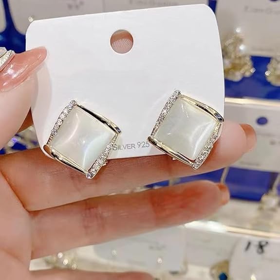 white and gold earrings